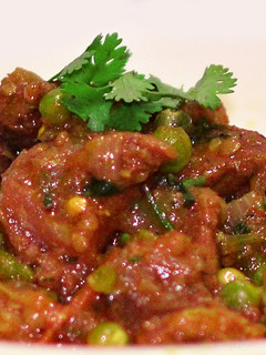 A picture of Spicy Beef Masala with Green Pea's.