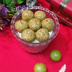 A picture of Gooseberry Sesame Coconut Laddoos.