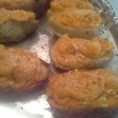 A picture of Once baked sweet & white potatoes.