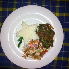 A picture of Rice,Omelet and star fried spinach.