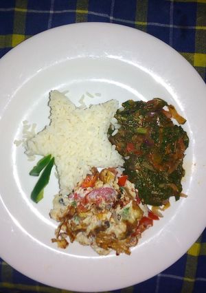 A picture of Rice,Omelet and star fried spinach.