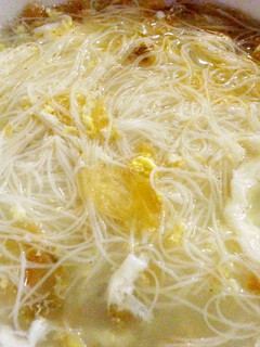 A picture of Bee hoon soup with dong cai and egg.