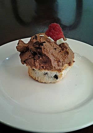 A picture of Chocolate Chip Angel.Food Cupcakes with Chocolate Whipped Cream Frosting.