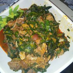 A picture of Vegetables soup with goat meat.