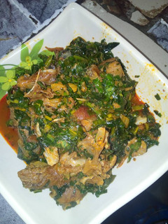 A picture of Vegetables soup with goat meat.