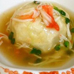 Taro Root Dumpling with Imitation Crab Meat Sauce A picture of Taro Root Dumpling with Imitation Crab Meat Sauce.