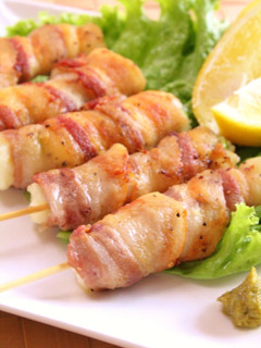 A picture of Crispy Skewered Pork Wraps with Edamame and Cheese.