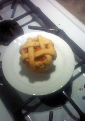 A picture of Apple pie baked in apple.