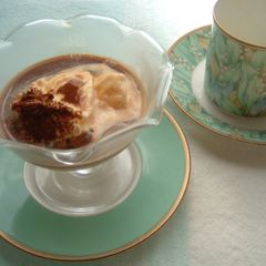 A picture of Vanilla Ice Cream Topped with Coffee.