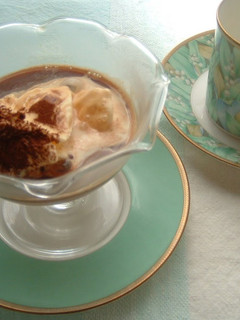 A picture of Vanilla Ice Cream Topped with Coffee.