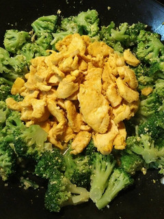 A picture of Golden Chicken in an Emerald Forest.