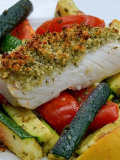 A picture of Zesty lemon pepper baked Cod and roasted vegetables.