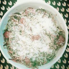 A picture of Kielbasa with veggies.