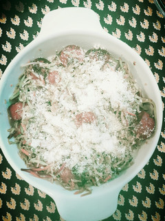 A picture of Kielbasa with veggies.