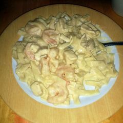 A picture of Chicken and shrimp Alfredo.
