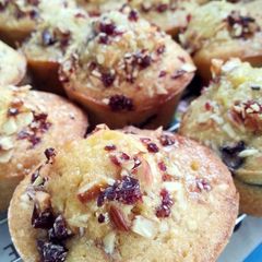 A picture of Orange and Almond Muffins with Orange Almond Syrup and a Almond and cranberry topping.