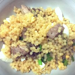 A picture of Couscous with chicken and egg.