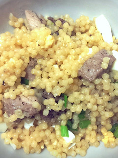 A picture of Couscous with chicken and egg.