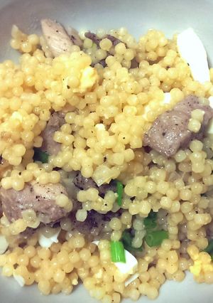A picture of Couscous with chicken and egg.
