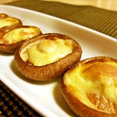 A picture of Shiitake Mushrooms with Melted Cheese.
