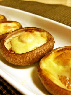 A picture of Shiitake Mushrooms with Melted Cheese.