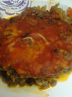 A picture of Vegetables and ground meat pie.