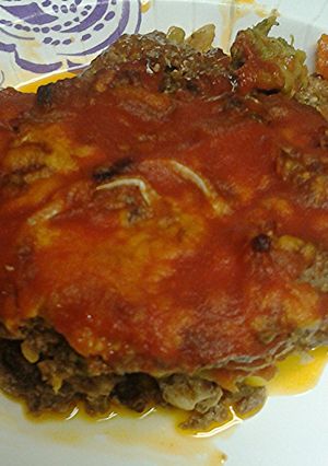 A picture of Vegetables and ground meat pie.