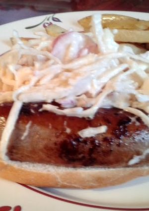 A picture of Beef Hot Dogs with Radish Slaw.