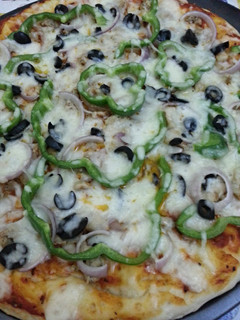 A picture of Chicken Super Supreme Pizza.