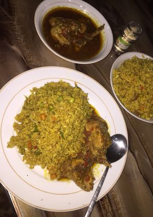 A picture of Fried rice with chicken pepper sauce.