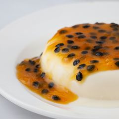 A picture of Panna Cotta with Passion Fruit Sauce.
