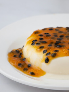 A picture of Panna Cotta with Passion Fruit Sauce.