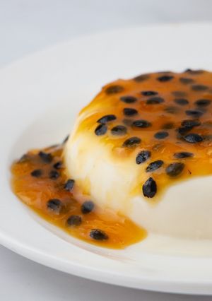 A picture of Panna Cotta with Passion Fruit Sauce.