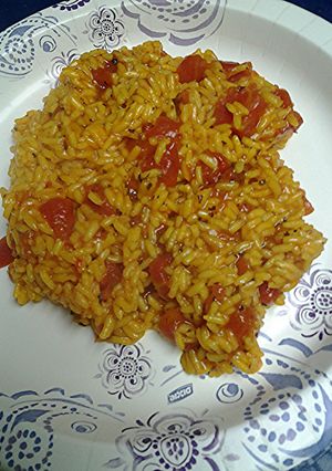 A picture of Herb and spice rice with tomatoes.