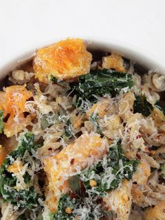 A picture of Butternut Squash and Kale Fusilli Pasta with Ricotta and topped with Fried Sage and Parmesan.