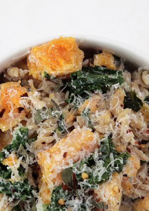 A picture of Butternut Squash and Kale Fusilli Pasta with Ricotta and topped with Fried Sage and Parmesan.