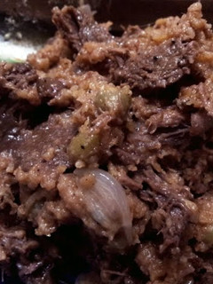 A picture of Beef in Wine with Green Peas.