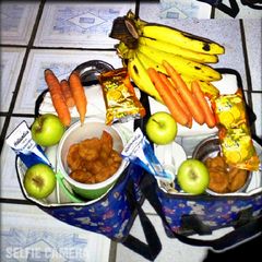 A picture of Akara, Banana, Apple and Carrots.