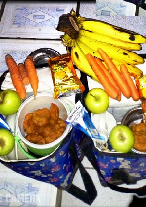 A picture of Akara, Banana, Apple and Carrots.