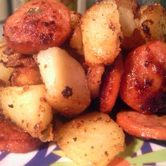 A picture of potatoe and sausage.