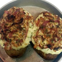 A picture of Twice Baked Potatoes with Goat Cheese, Carmalized Onions and Bacon.