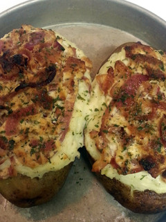 A picture of Twice Baked Potatoes with Goat Cheese, Carmalized Onions and Bacon.