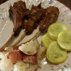 A picture of Rack of lamb with pear balsamic coulis.