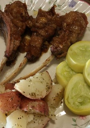 A picture of Rack of lamb with pear balsamic coulis.