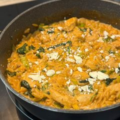 A picture of One-pan lemony chicken spinach orzo.
