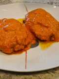 Libritos de lomo adobado en salsa de piquillos