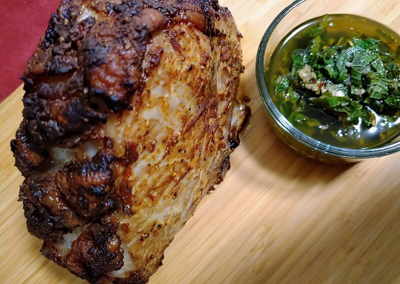 Curry mustard rubbed pork roast with mint chimichurri