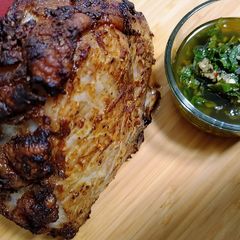 A picture of Curry mustard rubbed pork roast with mint chimichurri.