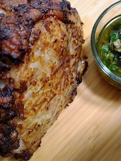 A picture of Curry mustard rubbed pork roast with mint chimichurri.