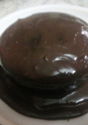 A picture of Chocolate cake with chocolate sauce.